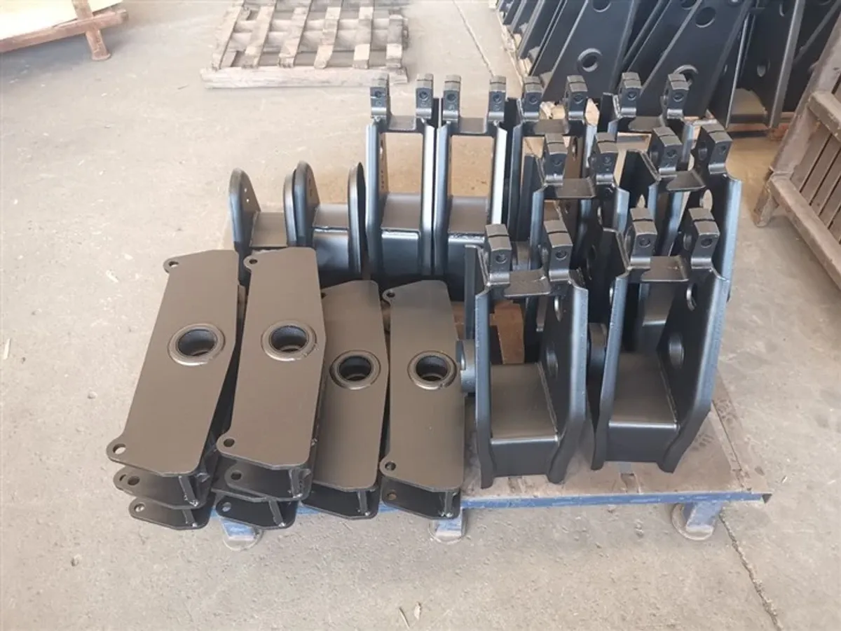 Trailer suspension equalizer brackets and hangers in warehouse