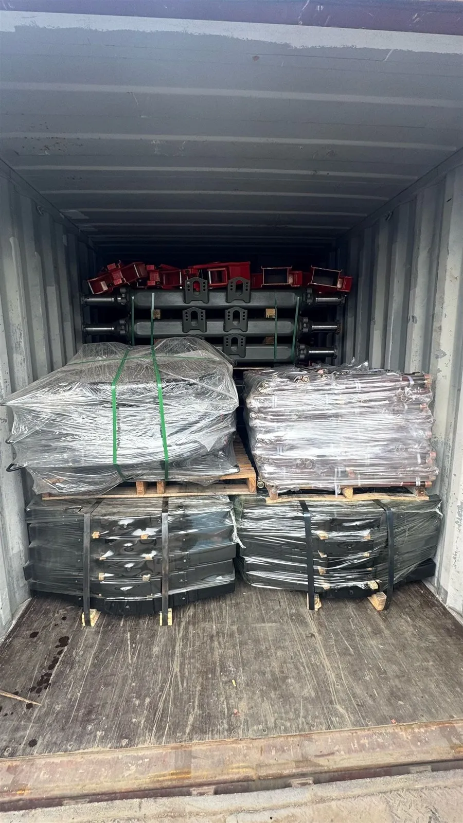 Suspension hanger brackets and stretch-wrapped pallets packed for shipment
