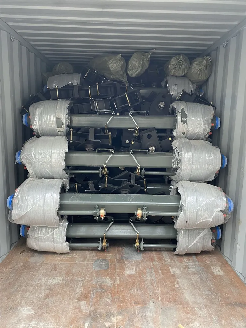 Trailer axles wrapped and loaded in a shipping container for export
